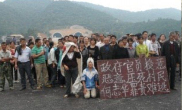 Chinese dissidents, Chinese protester opposing government takeover of village land 'is crushed to death by state-controlled road-flattening truck'